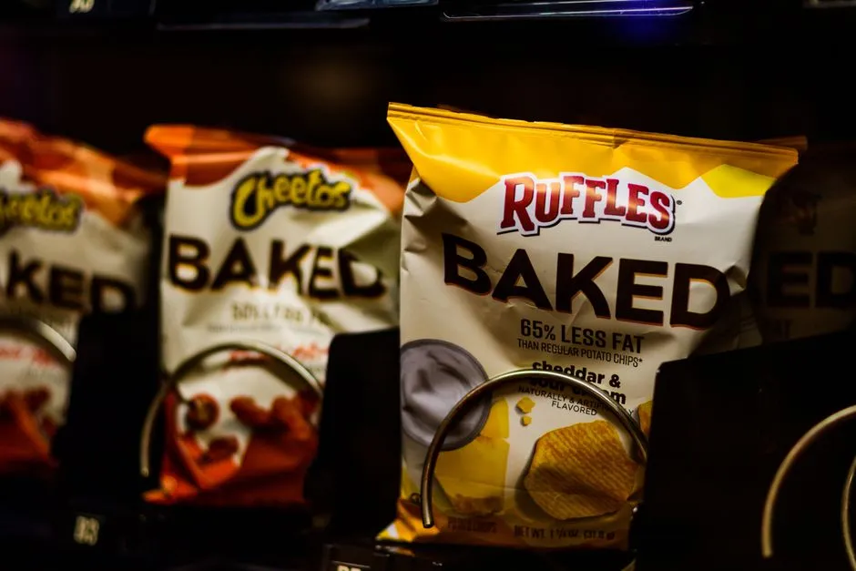 Packaged snack items in a vending machine, illustrative of commissary purchases