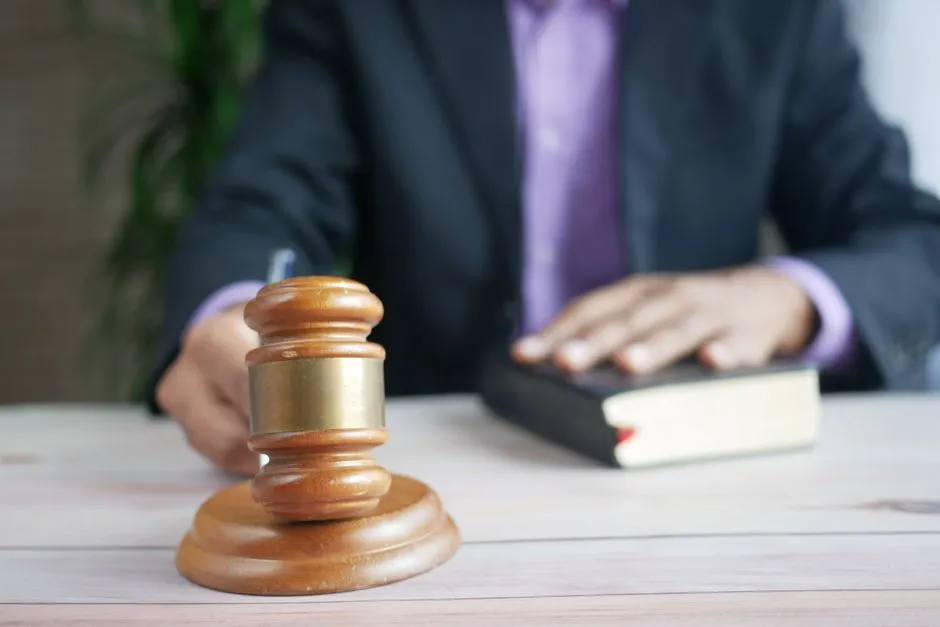 A wooden gavel resting on a desk, illustrative of legal rights information